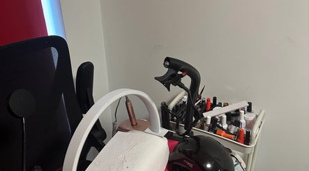Nail care station at NailsbyAsher in Coventry, England, GB, showcasing tools and polish collection.
