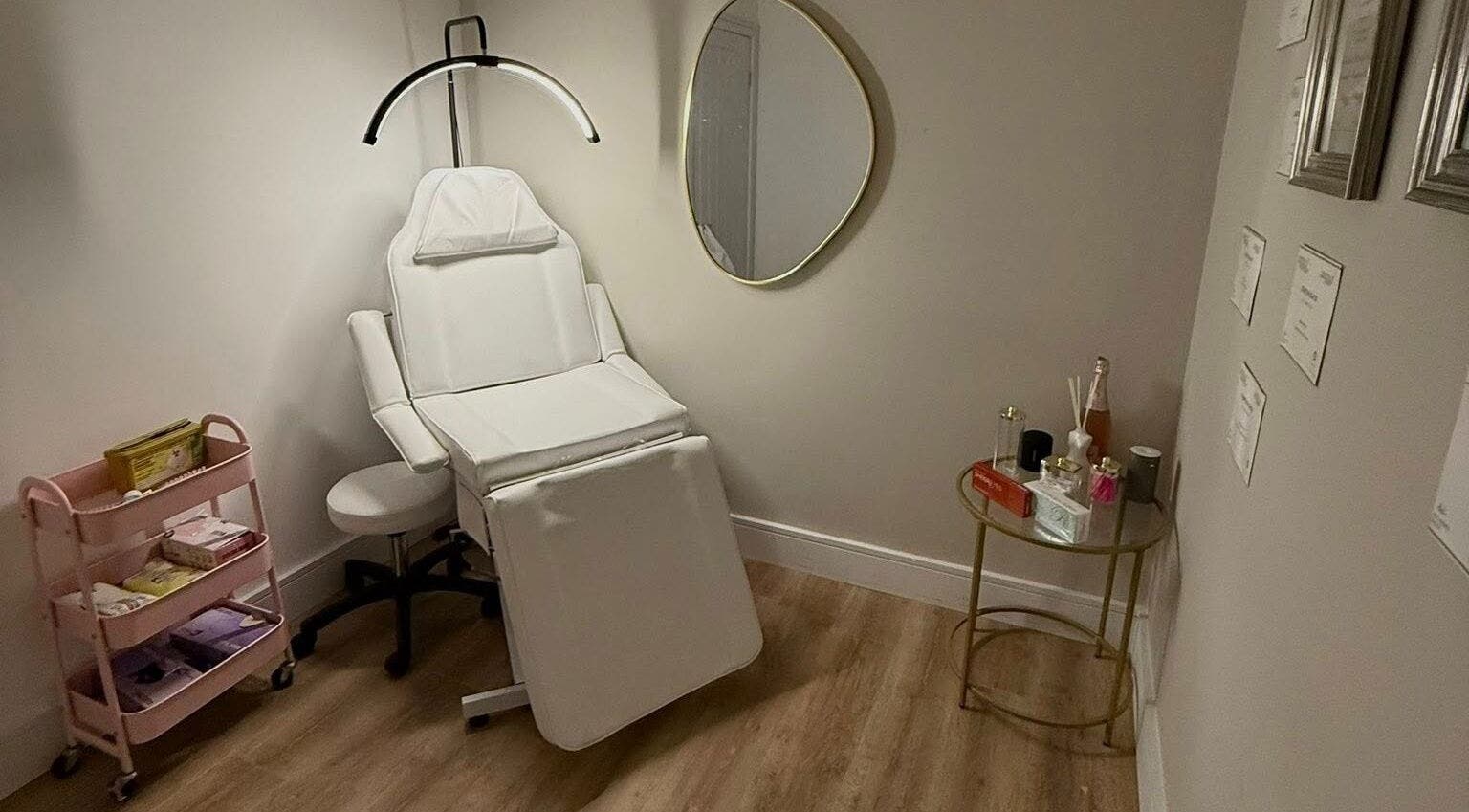 Aesthetic treatment room at Dollz Aesthetics NE, Hebburn, England with modern equipment and serene decor.