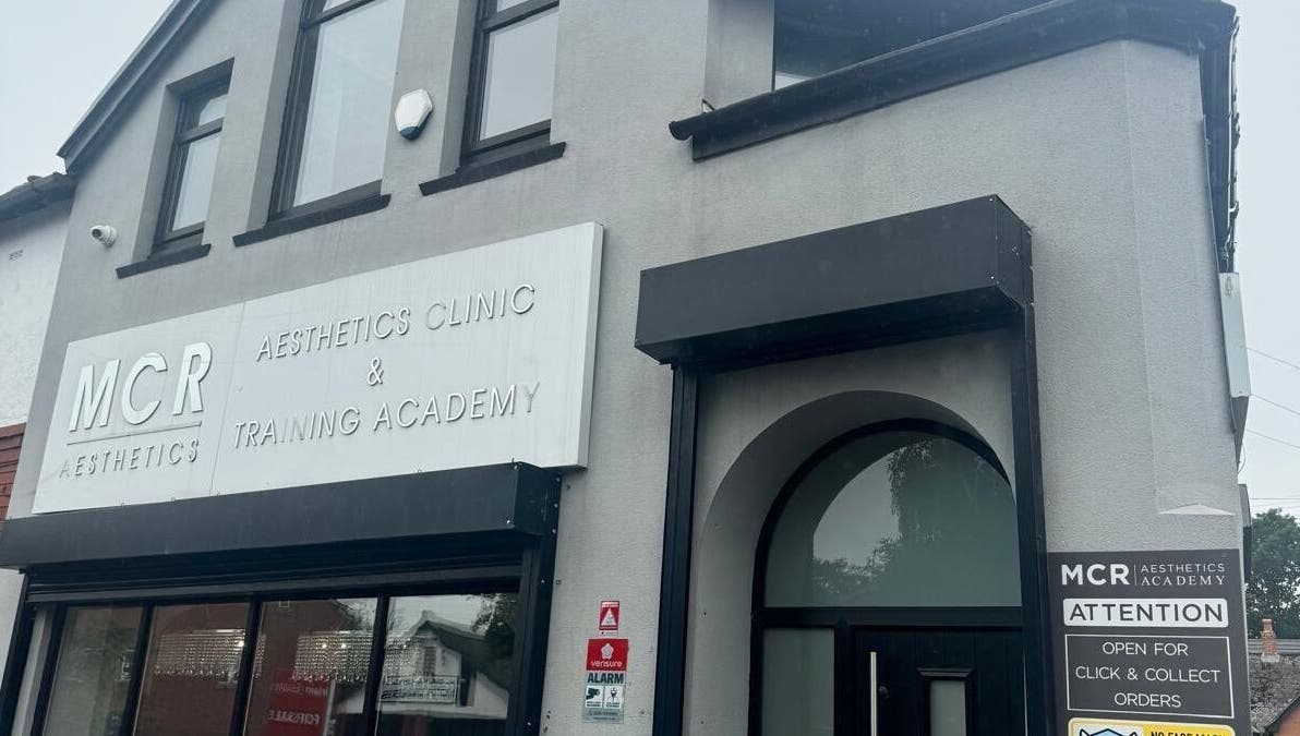 Entrance of MCR Medispa, Worsley, England, GB, showcasing modern aesthetics in a sleek building front.