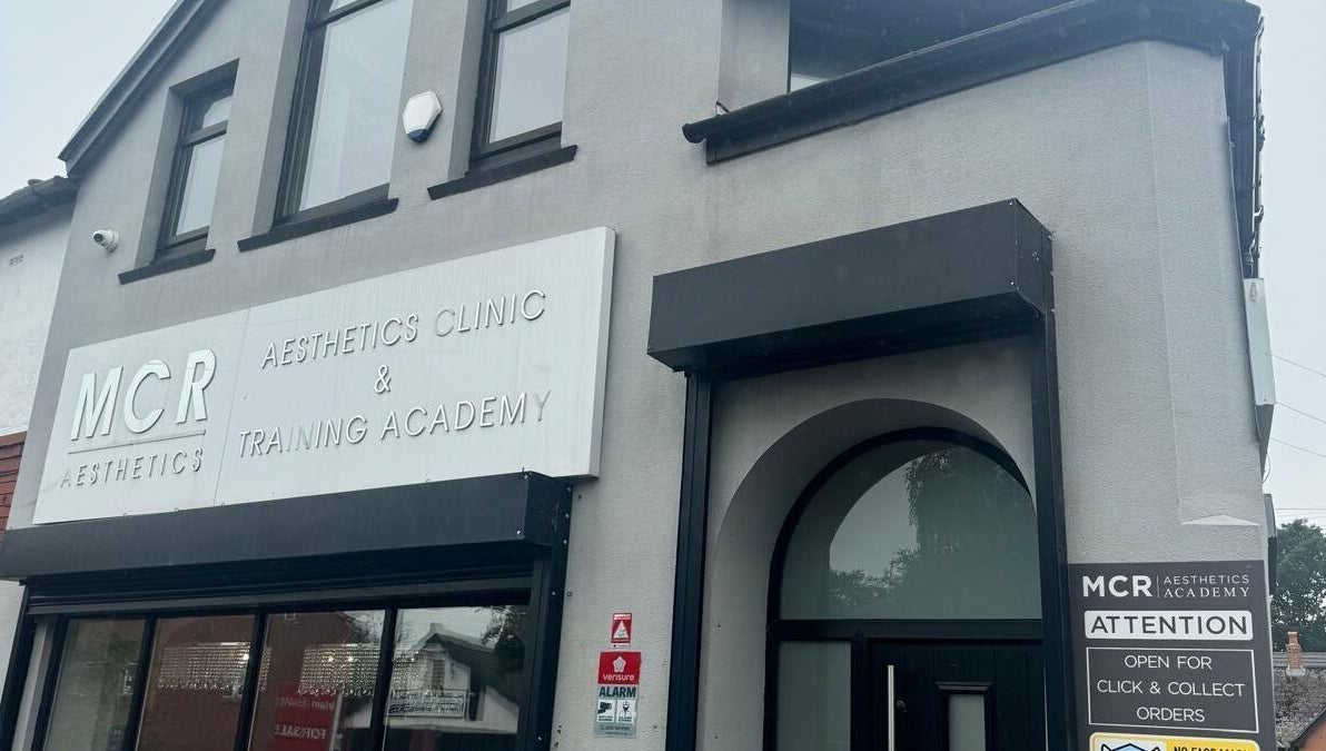 Entrance of MCR Medispa, Worsley, England, GB, showcasing modern aesthetics in a sleek building front.