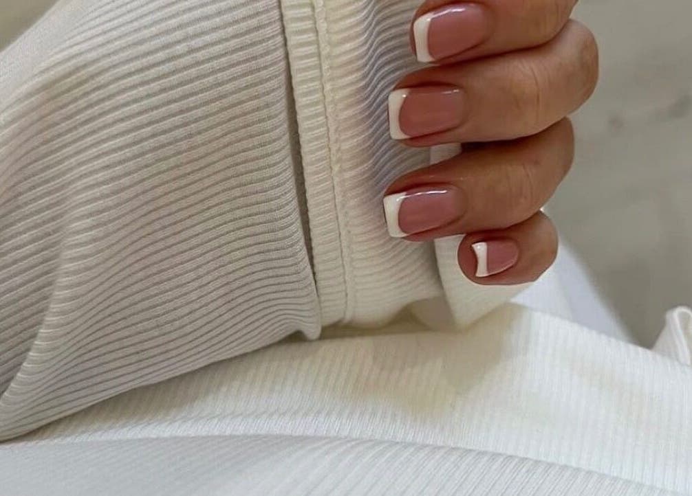Elegant French manicure at Nailsbykate in Stockton-on-tees, England, GB showcasing stylish nail art.