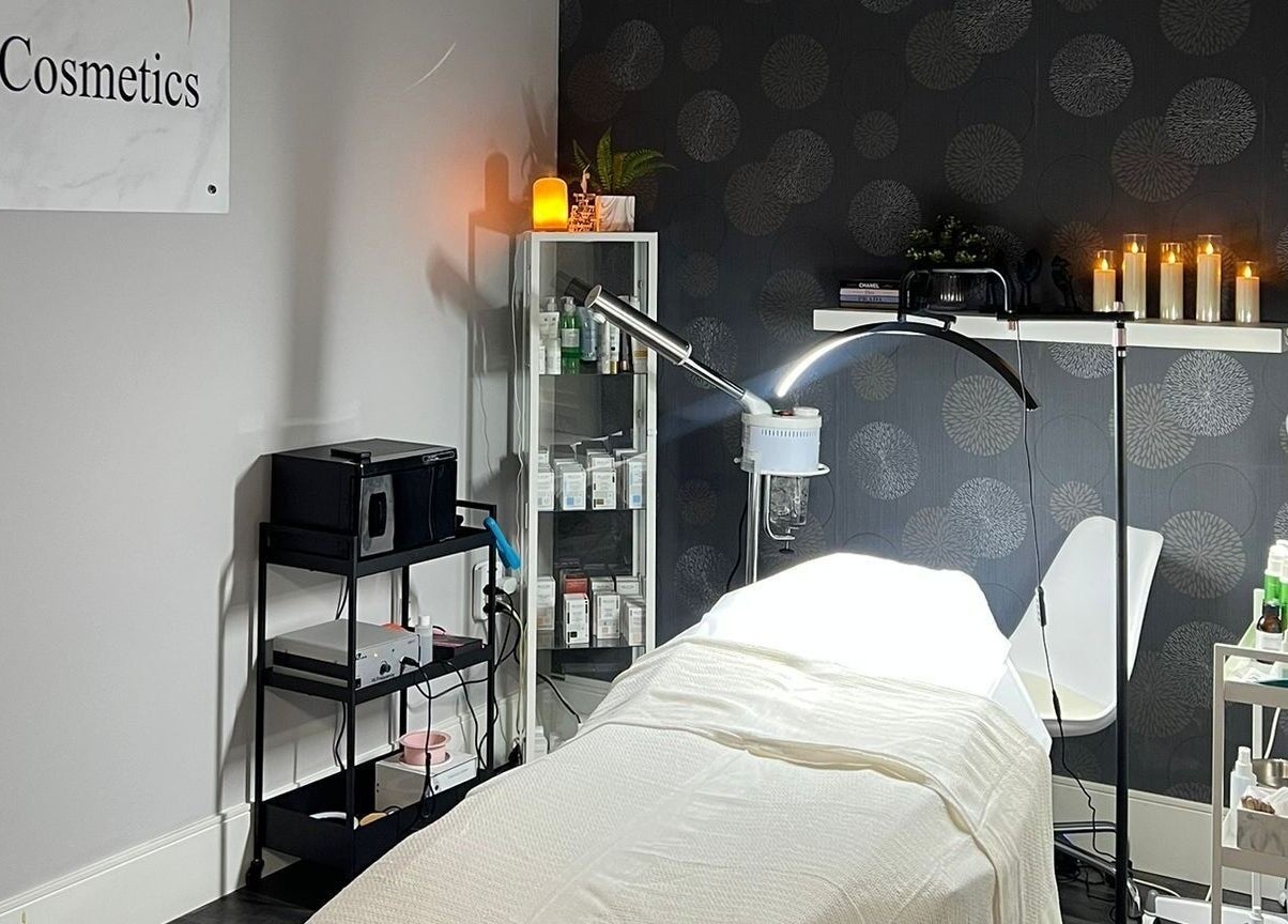 Cozy treatment room at Lini's Cosmetics, Vaughan, Ontario, CA with soft lighting and skincare products.