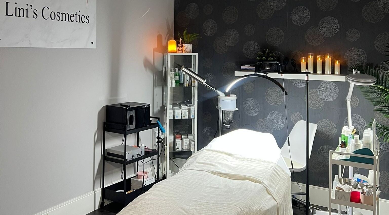 Cozy treatment room at Lini's Cosmetics, Vaughan, Ontario, CA with soft lighting and skincare products.