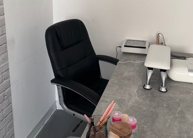 Comfortable nail salon workspace at FTC, Ipswich, England, GB with chair and manicure desk.