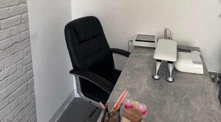 Comfortable nail salon workspace at FTC, Ipswich, England, GB with chair and manicure desk.