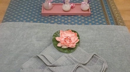 Lotus flower on towels at Champa Thai Massage, Budapest, Magyar, HU, offering a peaceful spa experience.