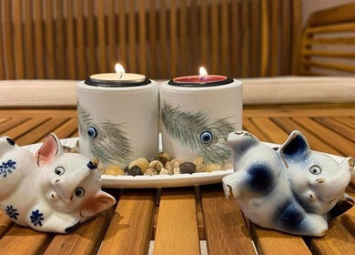 Cozy candle setup with decorative elephants at Champa Thai Massage, Budapest, Magyar, HU.