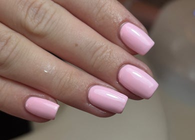 Glossy pink manicured nails at RB BEAUTY THERAPY, Glasgow, Scotland, GB. Perfect for elegant style.