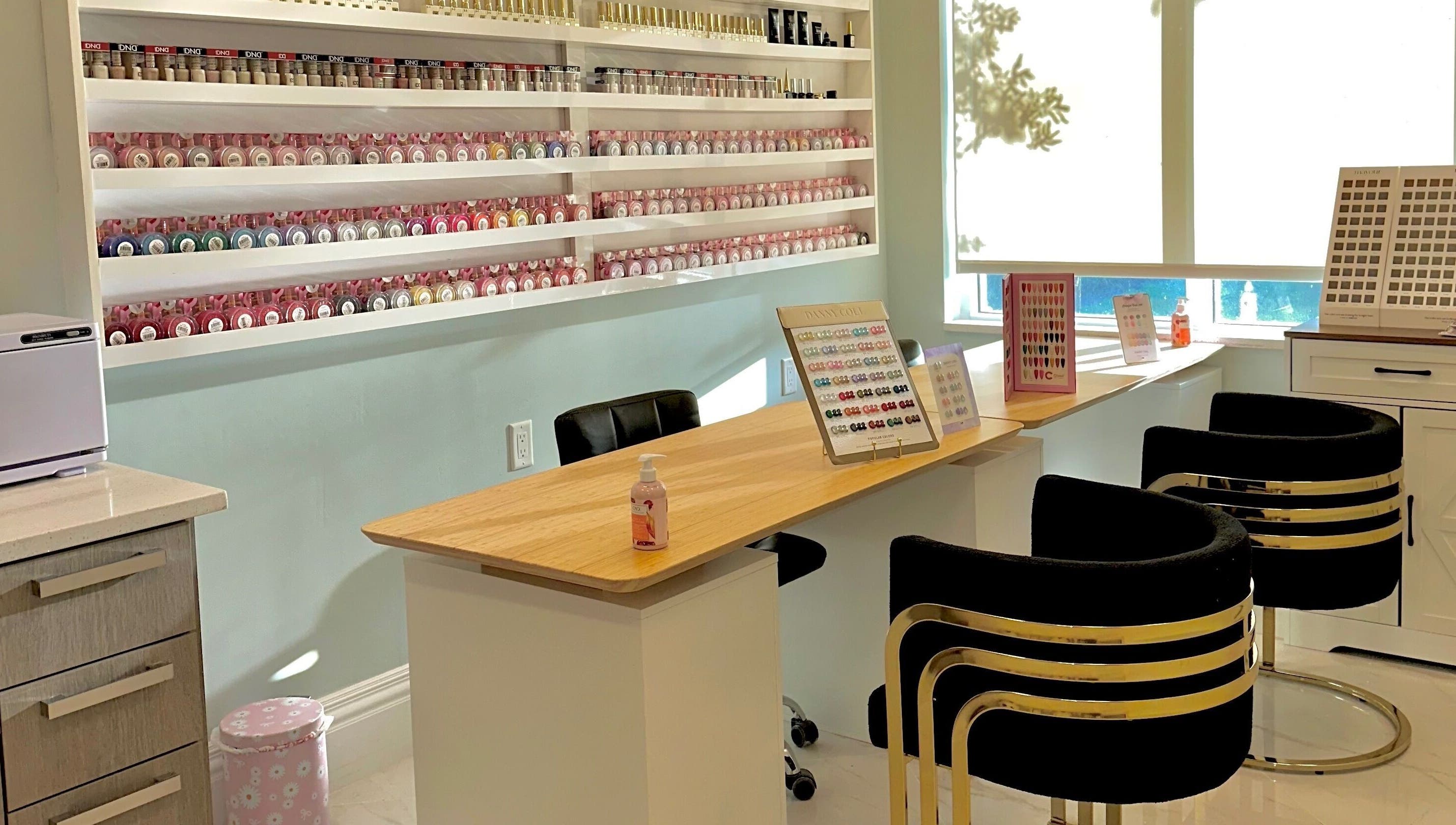 Elegant nail polish display at PMO Nails and Spa in Coral Springs, Florida, US, showcasing vibrant options.