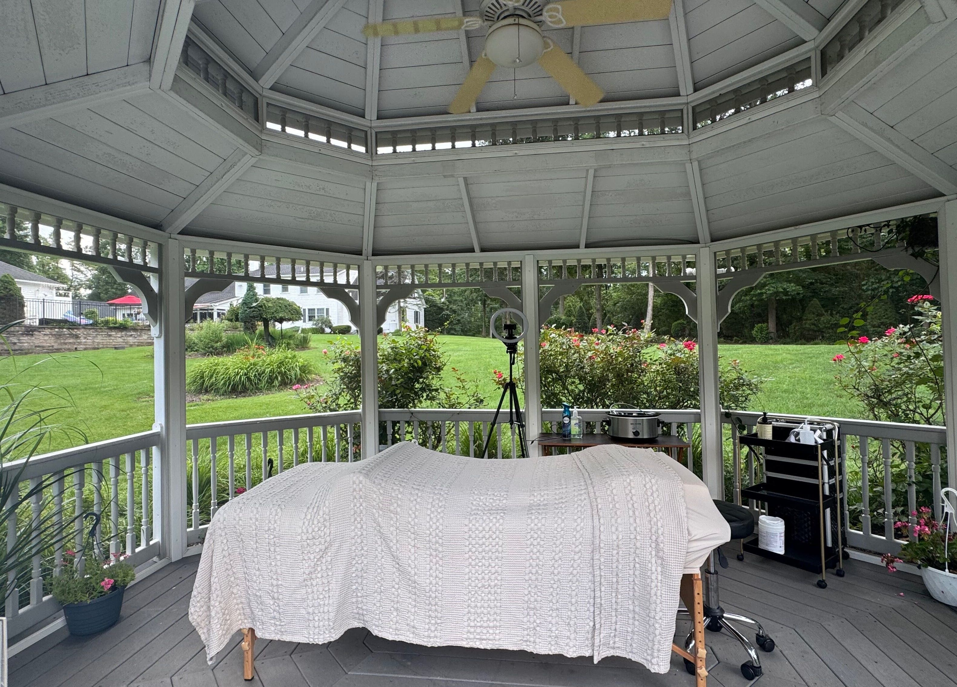 Relaxing spa setup in a gazebo at Aesthetically_Azaria, Green Lane, Pennsylvania, US.