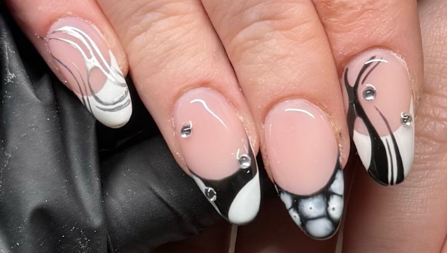 Black and white nail art at Holly Olivia Nails in Burnley, England, GB with intricate designs and rhinestones.