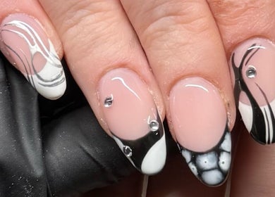 Black and white nail art at Holly Olivia Nails in Burnley, England, GB with intricate designs and rhinestones.