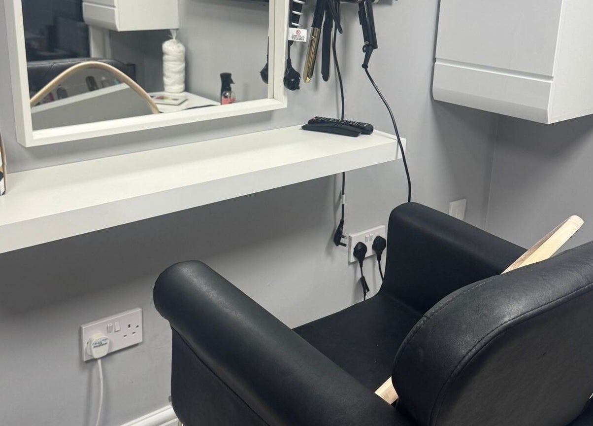 Modern salon chair and styling station at Mila Hair Atelier, Epsom, England, GB.