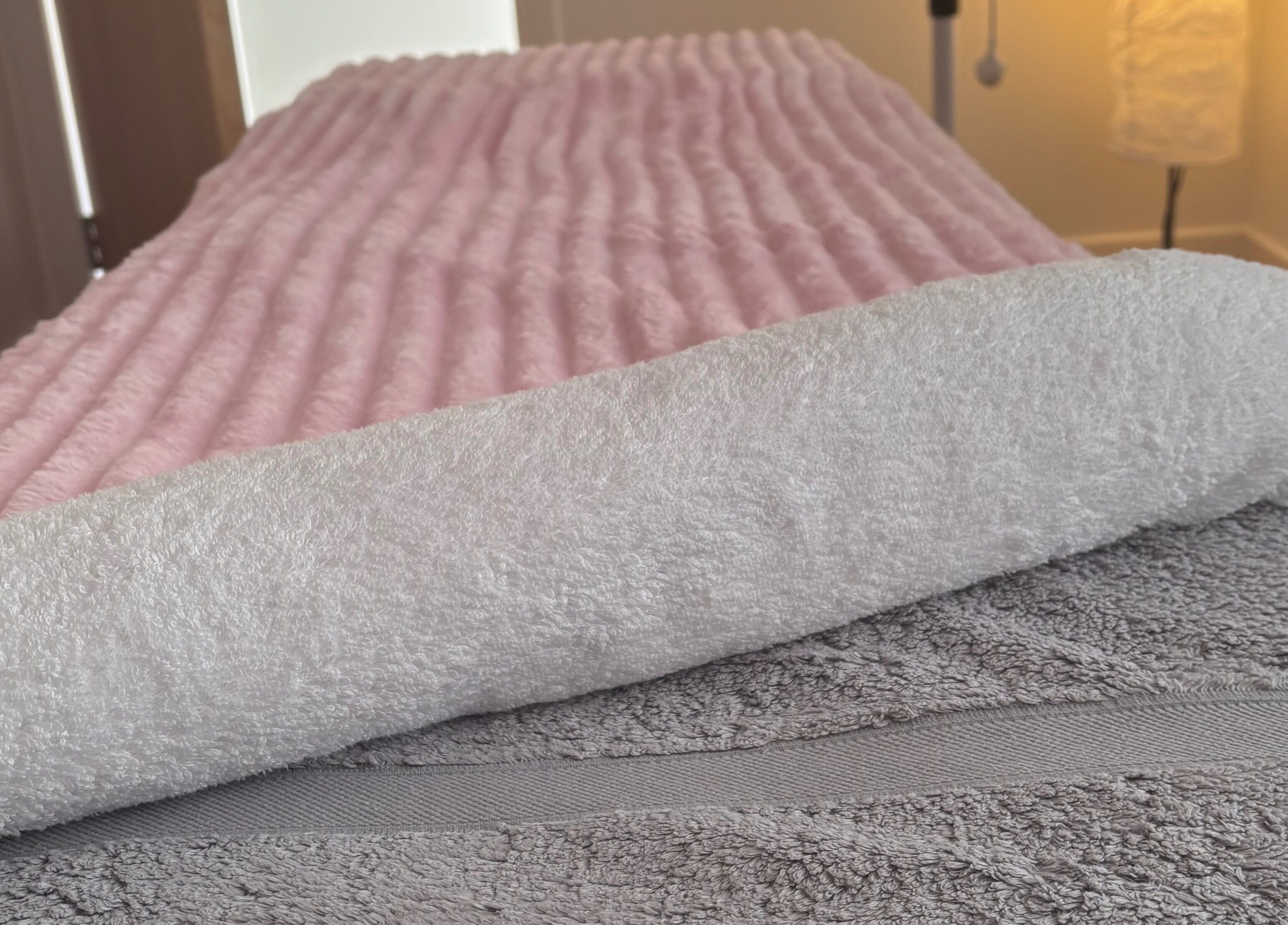 Luxurious pink and white towels at Relaxwithellis, Montrose, Scotland, GB, promising ultimate comfort.