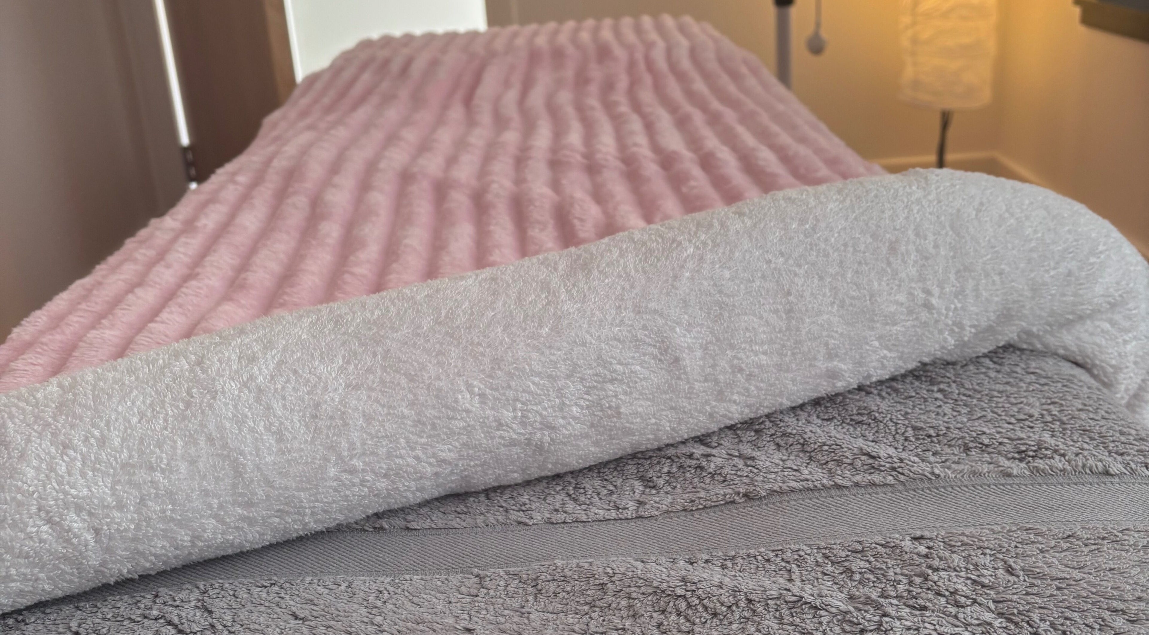 Luxurious pink and white towels at Relaxwithellis, Montrose, Scotland, GB, promising ultimate comfort.