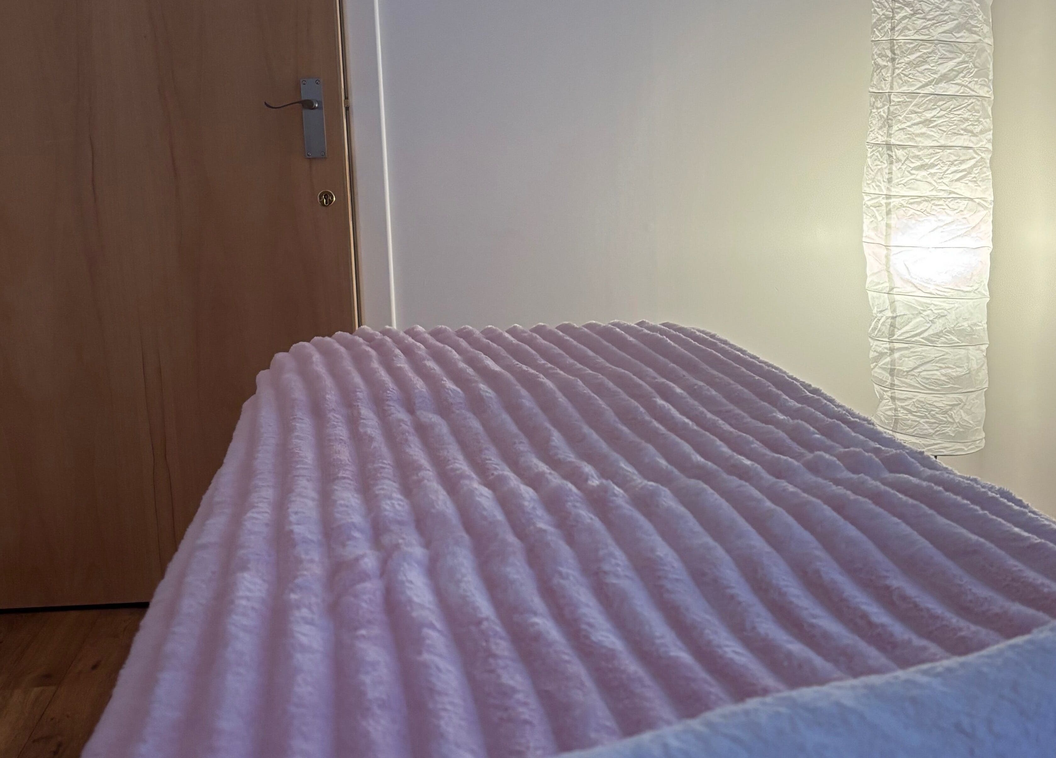 Cozy spa bed in warm lighting at Relaxwithellis, Montrose, Scotland, GB.
