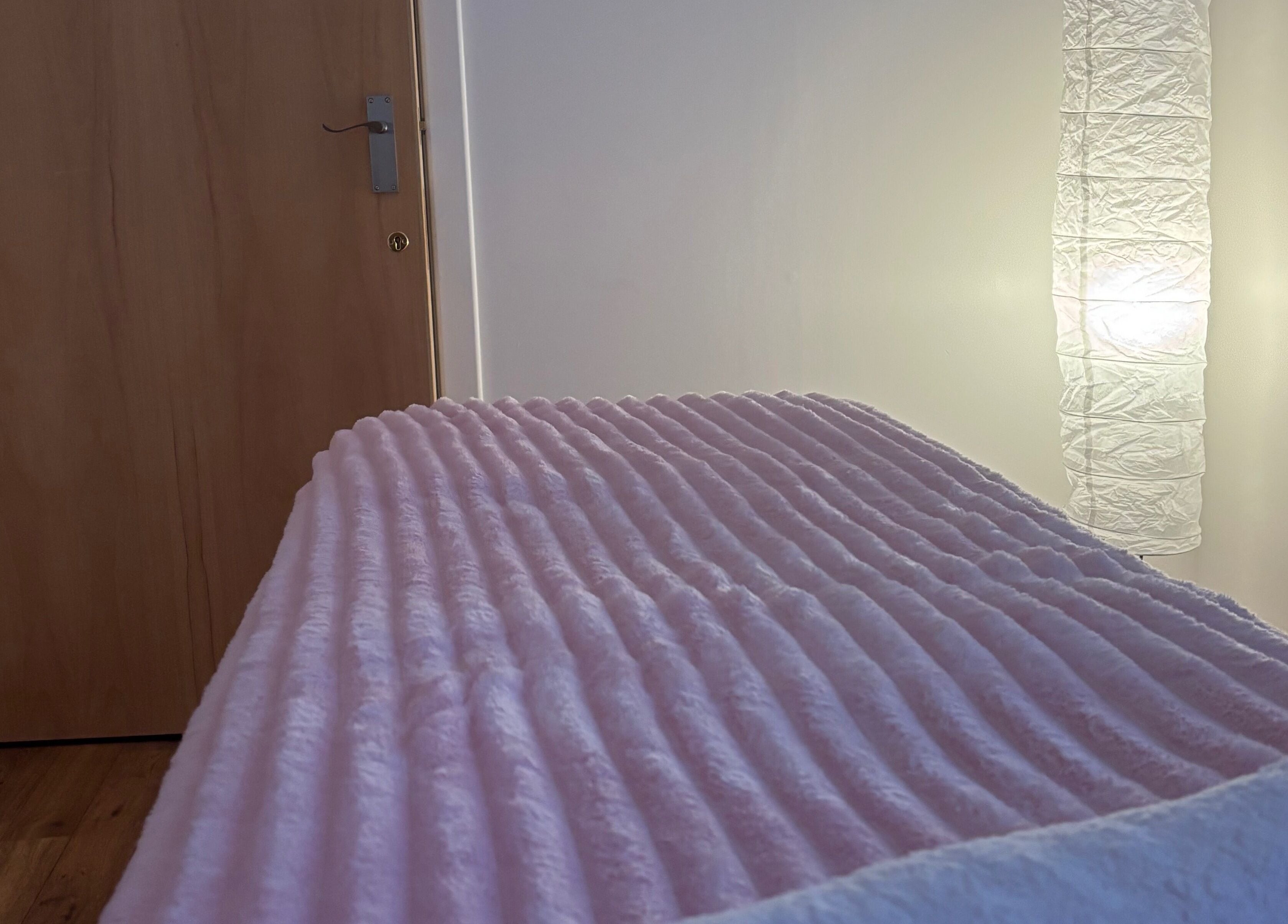 Cozy spa bed in warm lighting at Relaxwithellis, Montrose, Scotland, GB.