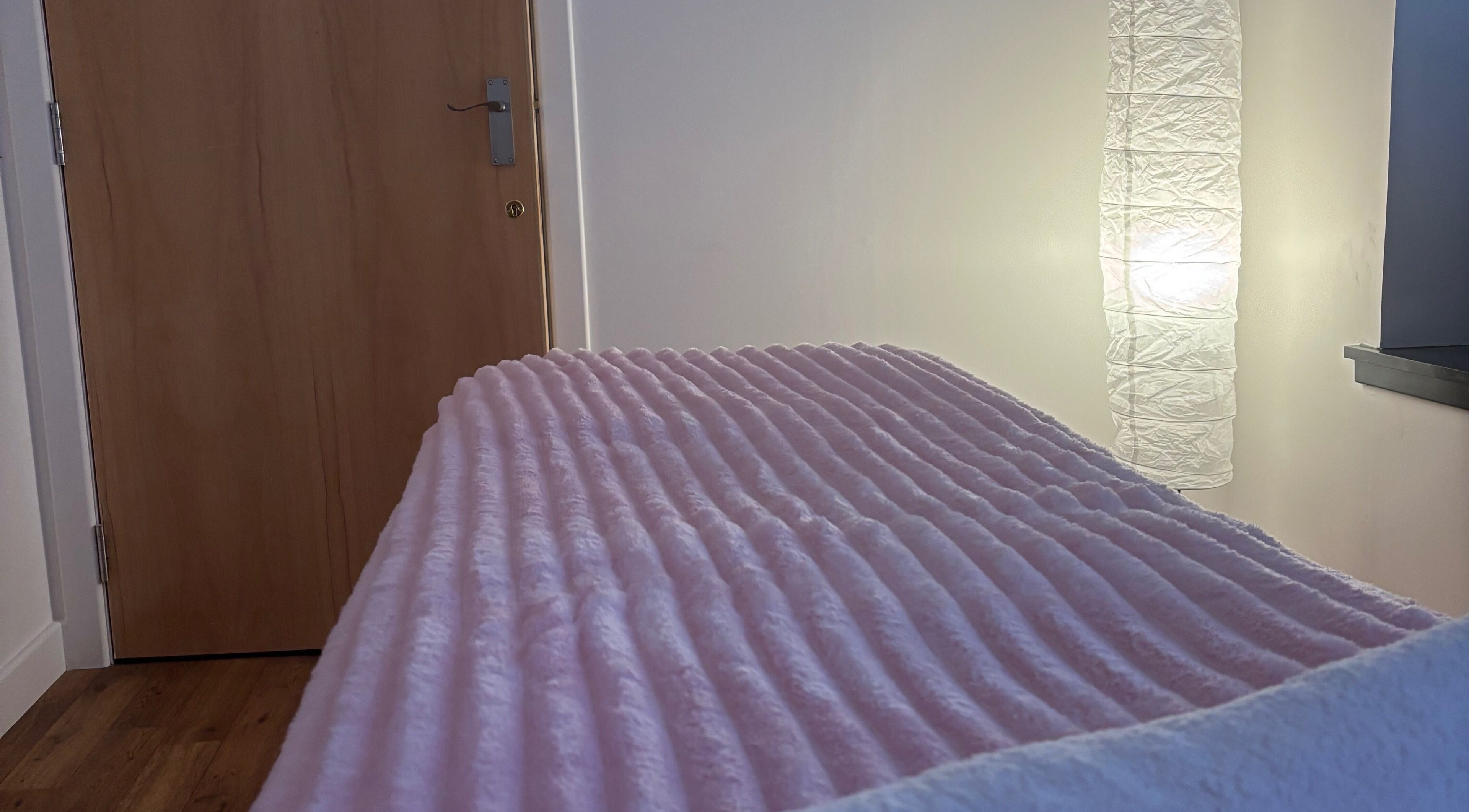 Cozy spa bed in warm lighting at Relaxwithellis, Montrose, Scotland, GB.