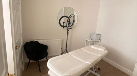 Calm treatment room at Ocean Head & Body Spa | By Kait | Chester, England, GB with plush chair and massage table.