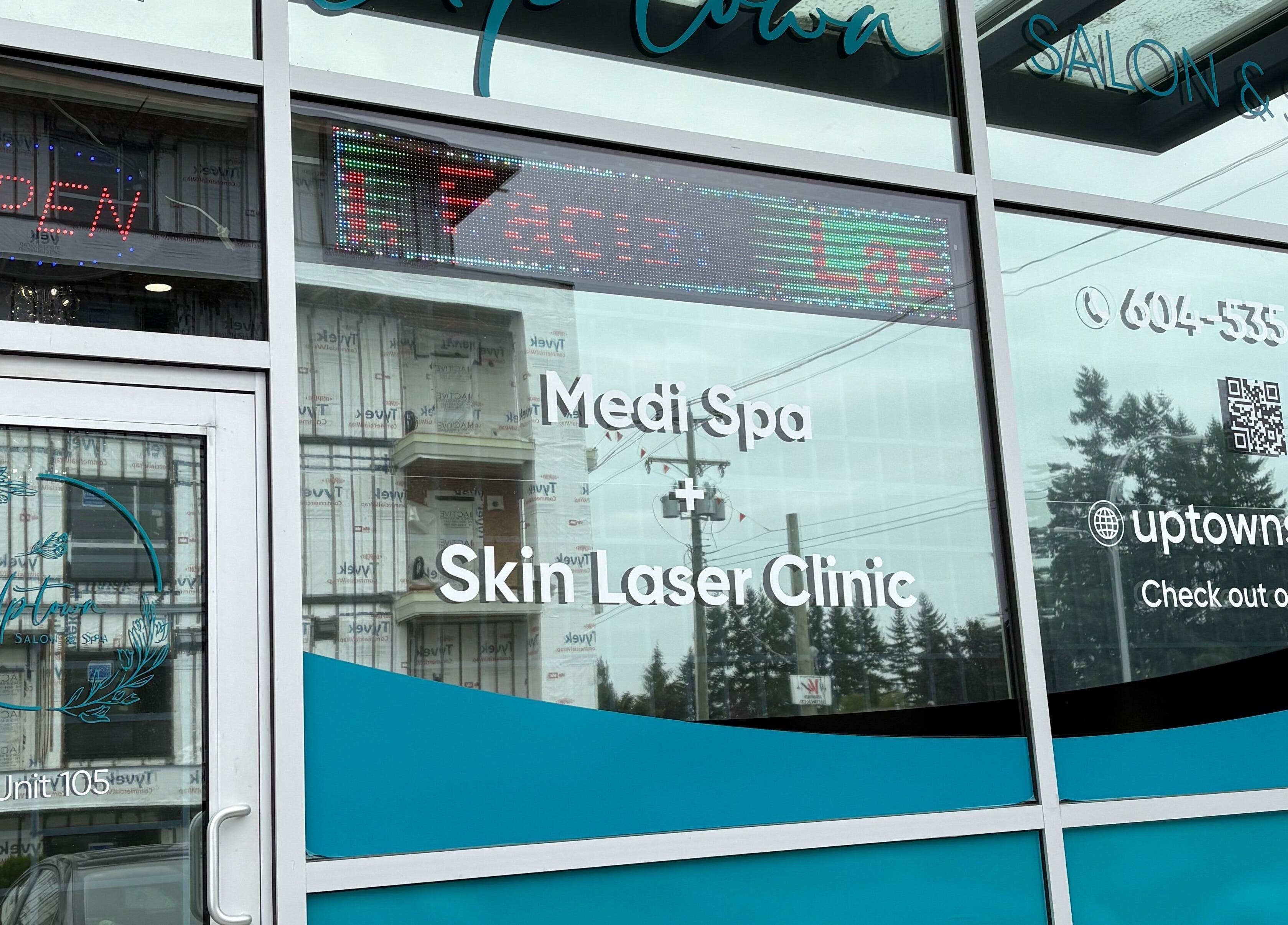 Front entrance of Uptown Salon and Spa, Surrey, British Columbia, CA with signage and contact details.
