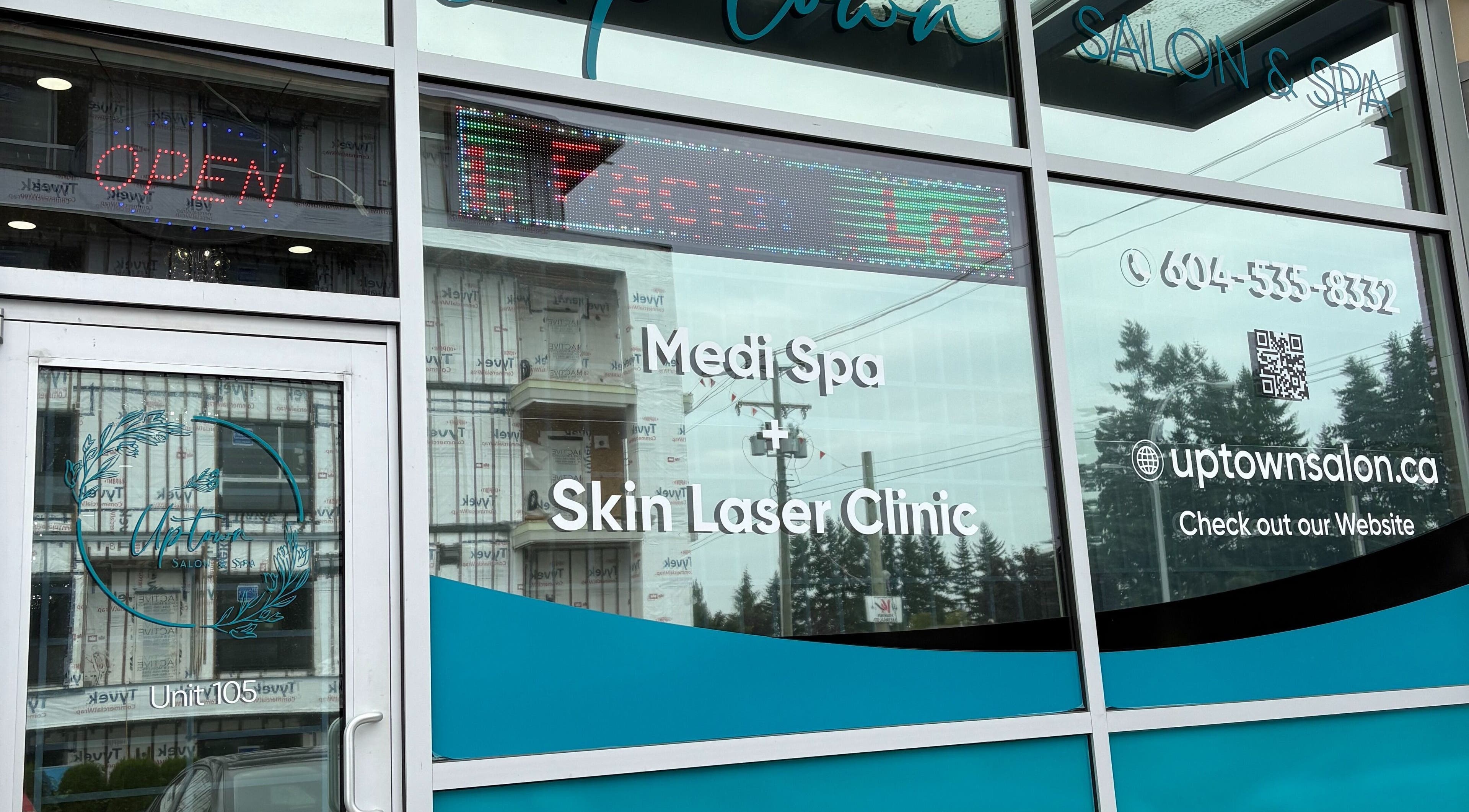 Front entrance of Uptown Salon and Spa, Surrey, British Columbia, CA with signage and contact details.