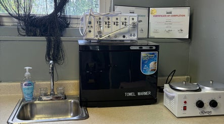 Emerald Suite spa essentials, including towel warmer and sink, in Pittsburgh, Pennsylvania, US.