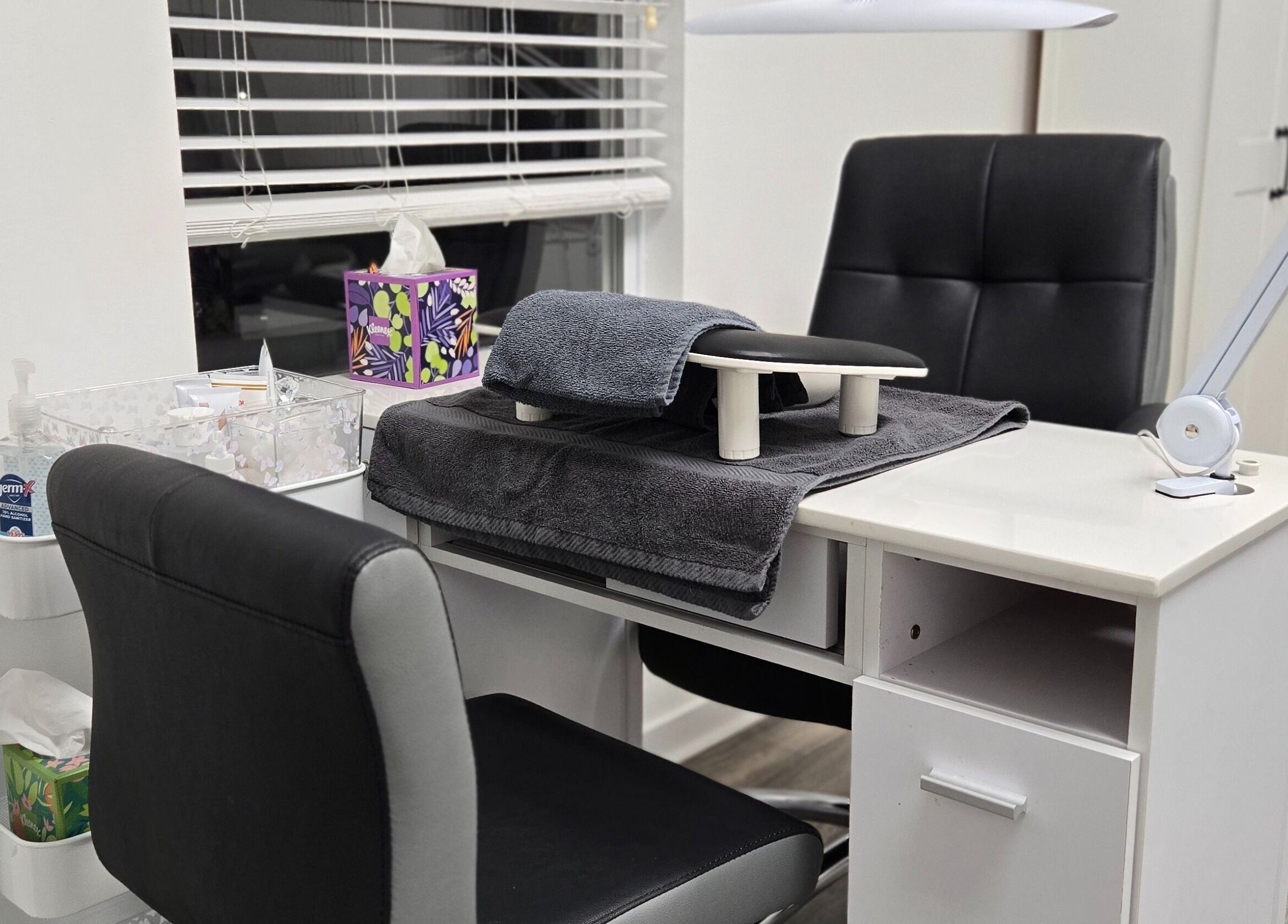 Manicure station at Four Seasons Beauty Salon in Doylestown, Pennsylvania, US with sleek chairs and organized supplies.