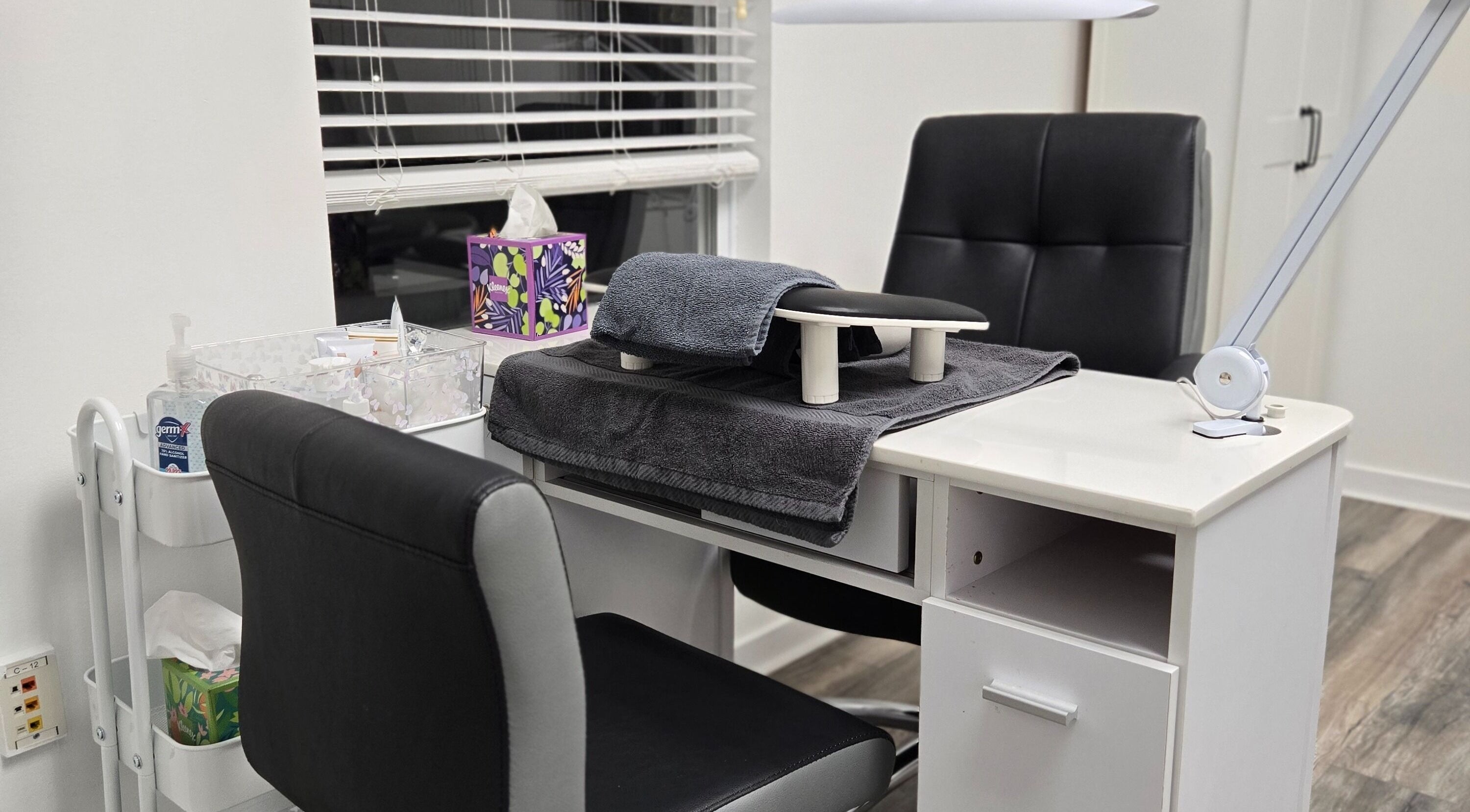Manicure station at Four Seasons Beauty Salon in Doylestown, Pennsylvania, US with sleek chairs and organized supplies.