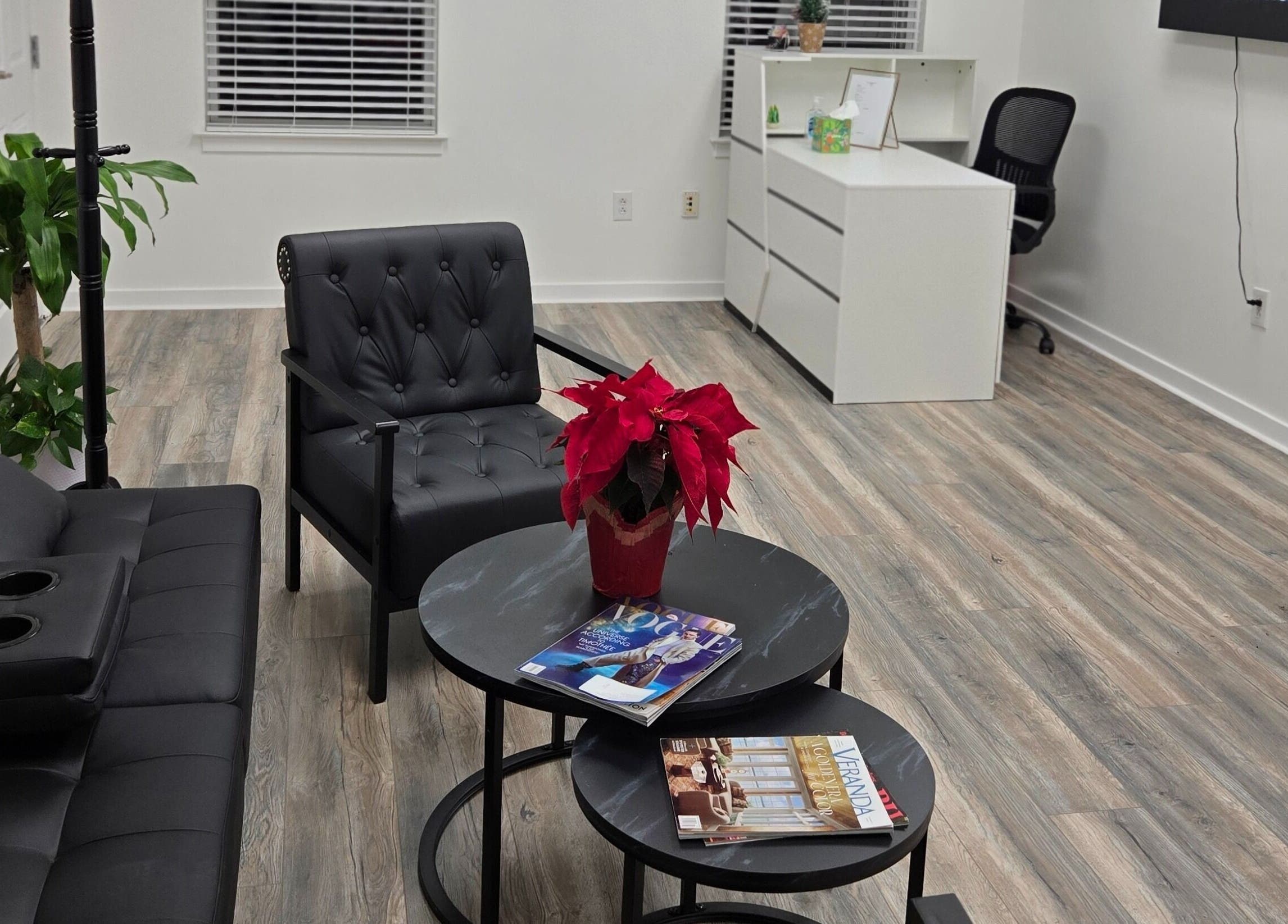 Modern lounge area at Four Seasons Beauty Salon, Doylestown, Pennsylvania, US with plush seating and decor.