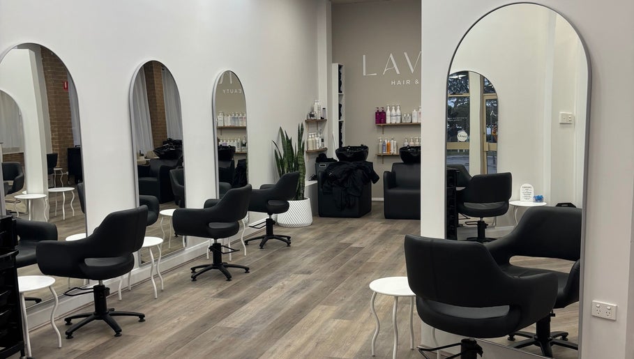 Sleek interior of Tjf Hair in Melbourne, Victoria, AU featuring stylish chairs and mirrors.