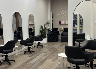 Sleek interior of Tjf Hair in Melbourne, Victoria, AU featuring stylish chairs and mirrors.