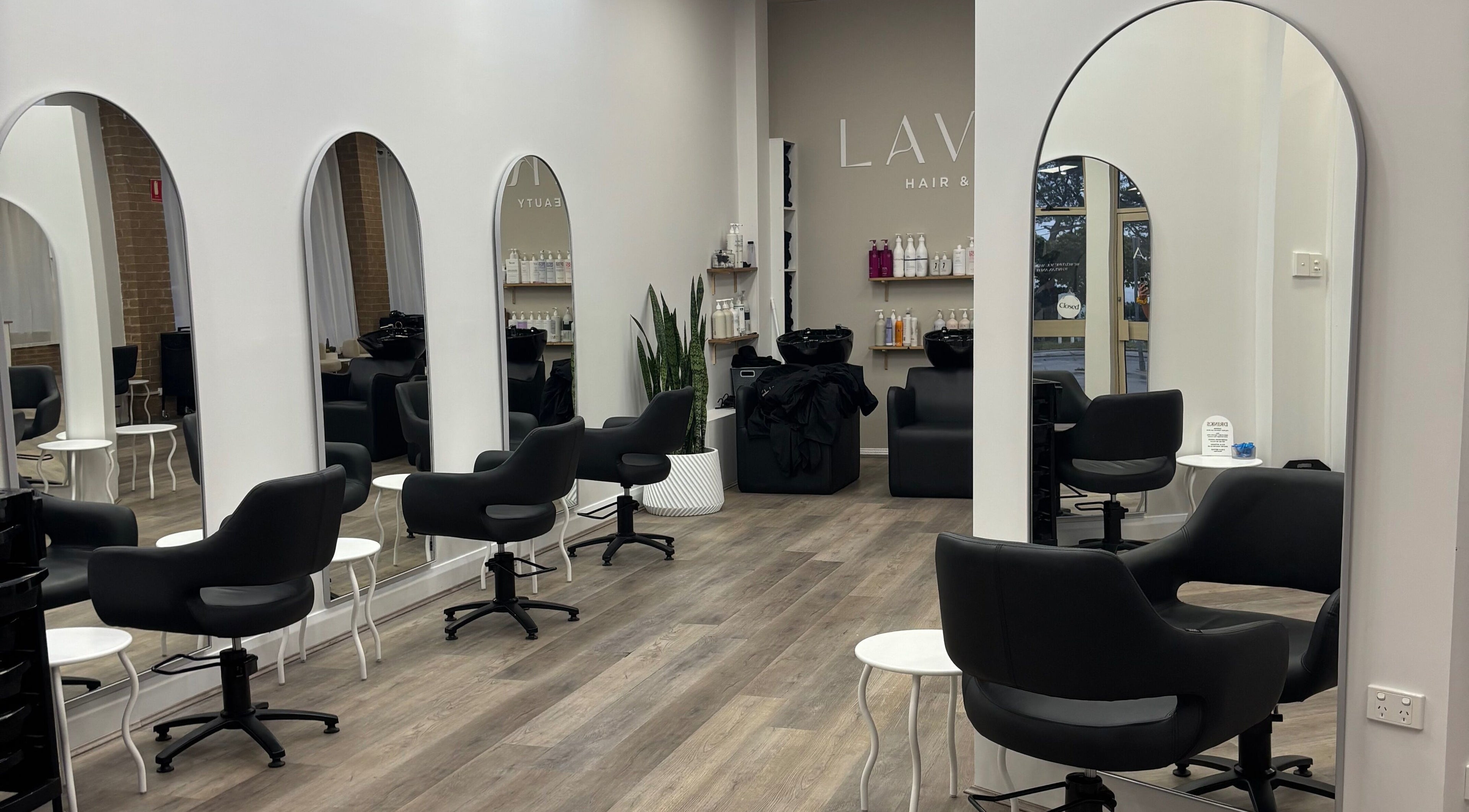 Sleek interior of Tjf Hair in Melbourne, Victoria, AU featuring stylish chairs and mirrors.
