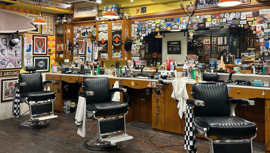 Vintage barber chairs at The Outro Barbershop in 서울특별시, 서울특별시, KR, showcasing a vibrant, eclectic decor.