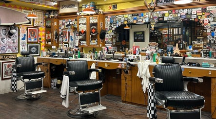 Vintage barber chairs at The Outro Barbershop in 서울특별시, 서울특별시, KR, showcasing a vibrant, eclectic decor.