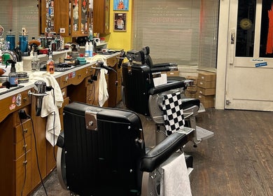 Inside The Outro Barbershop, 서울특별시, KR: vintage-style chairs, grooming tools, and cozy ambiance.