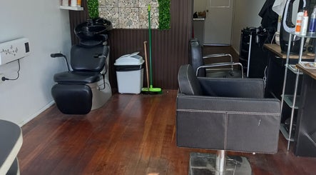 Modern salon interior at Jodie's hair room, Woodville Park, South Australia, AU with stylish chairs.