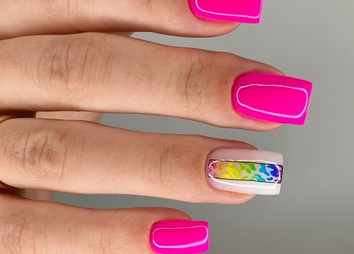 Bright pink and rainbow nail art at MoJo Nails, Eden Prairie, Minnesota, US. Stunning and colorful designs.
