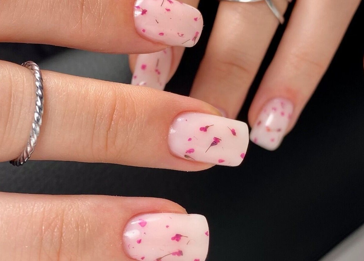 Beautiful pink and white floral nails from MoJo Nails in Eden Prairie, Minnesota, US.