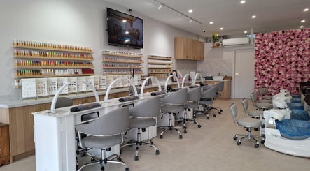 Modern nail salon interior at Emerald Nails, Camden, New South Wales, AU, featuring elegant decor and workstations.