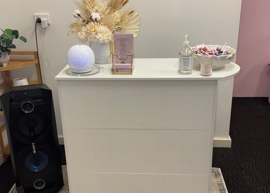 Reception area at Goddess Glow Salon, Melbourne, Victoria, AU with elegant decor and beauty products.