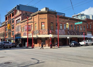 Street view of Marc Revita - New Shanghai Barbershop at a busy Vancouver intersection, British Columbia, CA.
