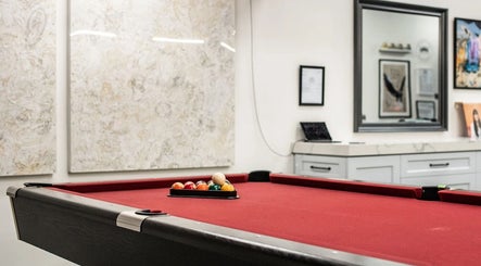 Pool table in Marc Revita - New Shanghai Barbershop, Vancouver, British Columbia, CA, creating a stylish ambiance.