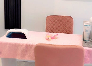 Nail station at La Vie en Beauty, Bristol, England, GB, featuring pink decor and manicure tools.