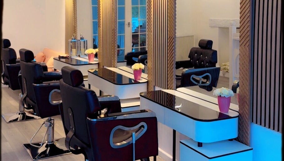 Stylish interior of La Vie en Beauty salon in Bristol, England, GB with modern chairs and mirrors.