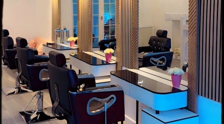 Stylish interior of La Vie en Beauty salon in Bristol, England, GB with modern chairs and mirrors.