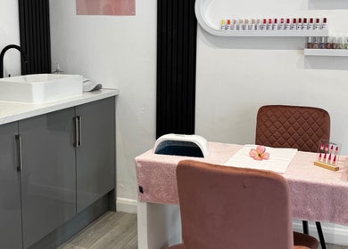 Elegant nail care station at La Vie en Beauty, Bristol, England, GB, featuring plush seating and nail polish display.