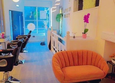 Stylish interior of La Vie en Beauty salon in Bristol, England, GB. Features sleek chairs and cozy seating.