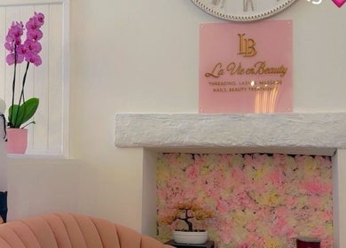 Elegant pink floral wall decor at La Vie en Beauty spa, Bristol, England, GB.