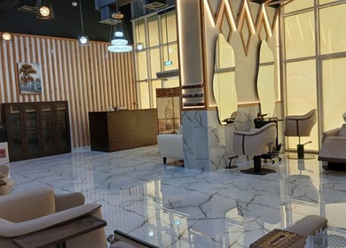 Elegant salon interior at Velvet Glow Ladies Salon, Dubai, Dubai, AE featuring stylish chairs and mirrors.