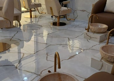 Luxury interior of Velvet Glow Ladies Salon, Dubai, Dubai, AE with plush chairs and marble basins.